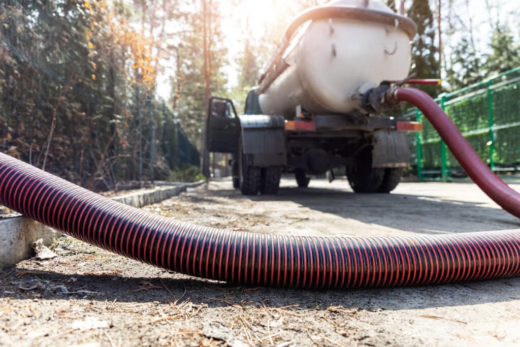 Septic truck pumping out a septic tank