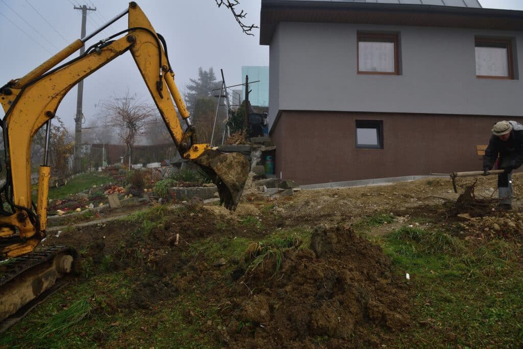 Excavator digging a cesspool