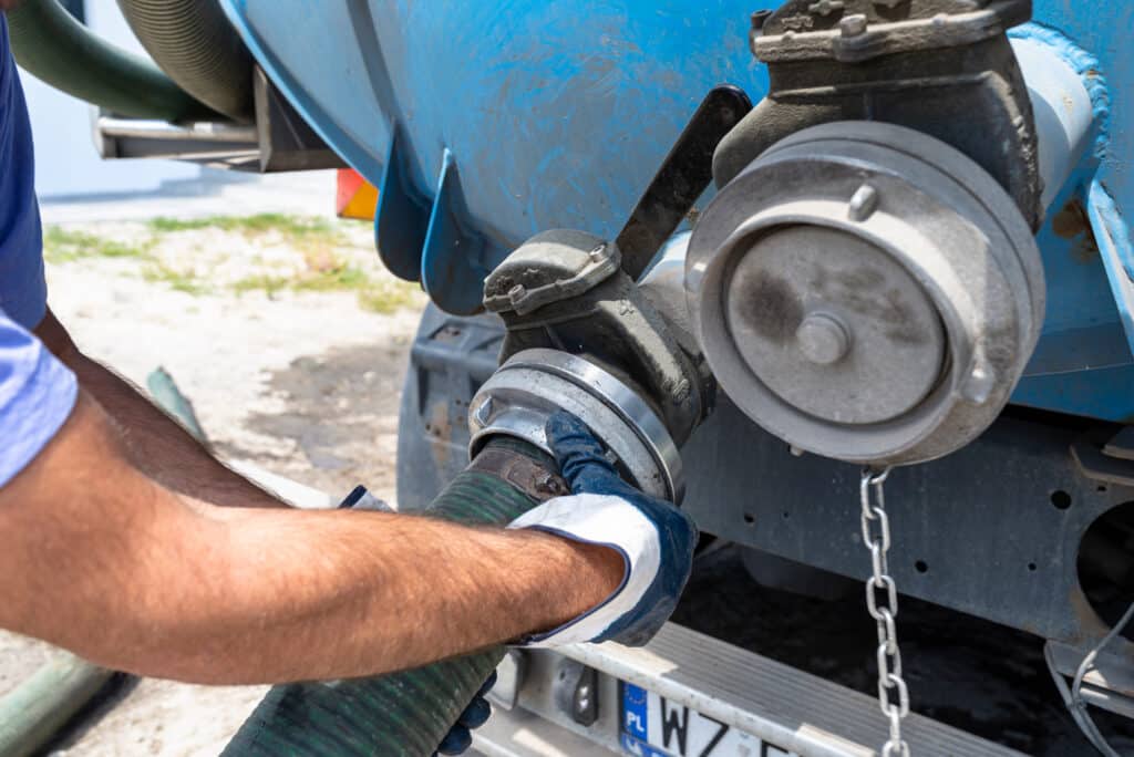 Connecting a 4-inch hose to a septic truck